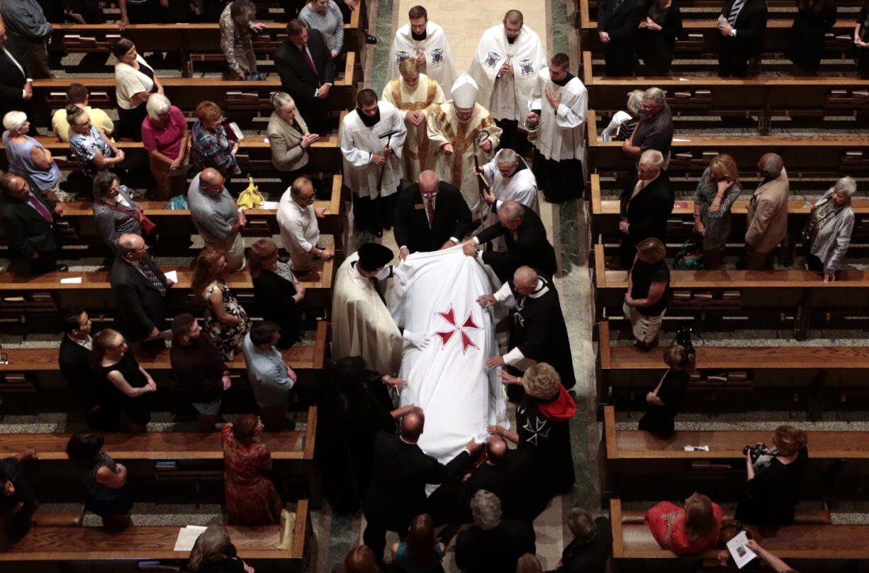 A pall is placed on the casket of Phyllis Schlafly, founder of the Eagle Forum, during her funeral Mass at the Cathedral Basilica of St. Louis on Saturday, Sept. 10, 2016.  (Robert Cohen/St.