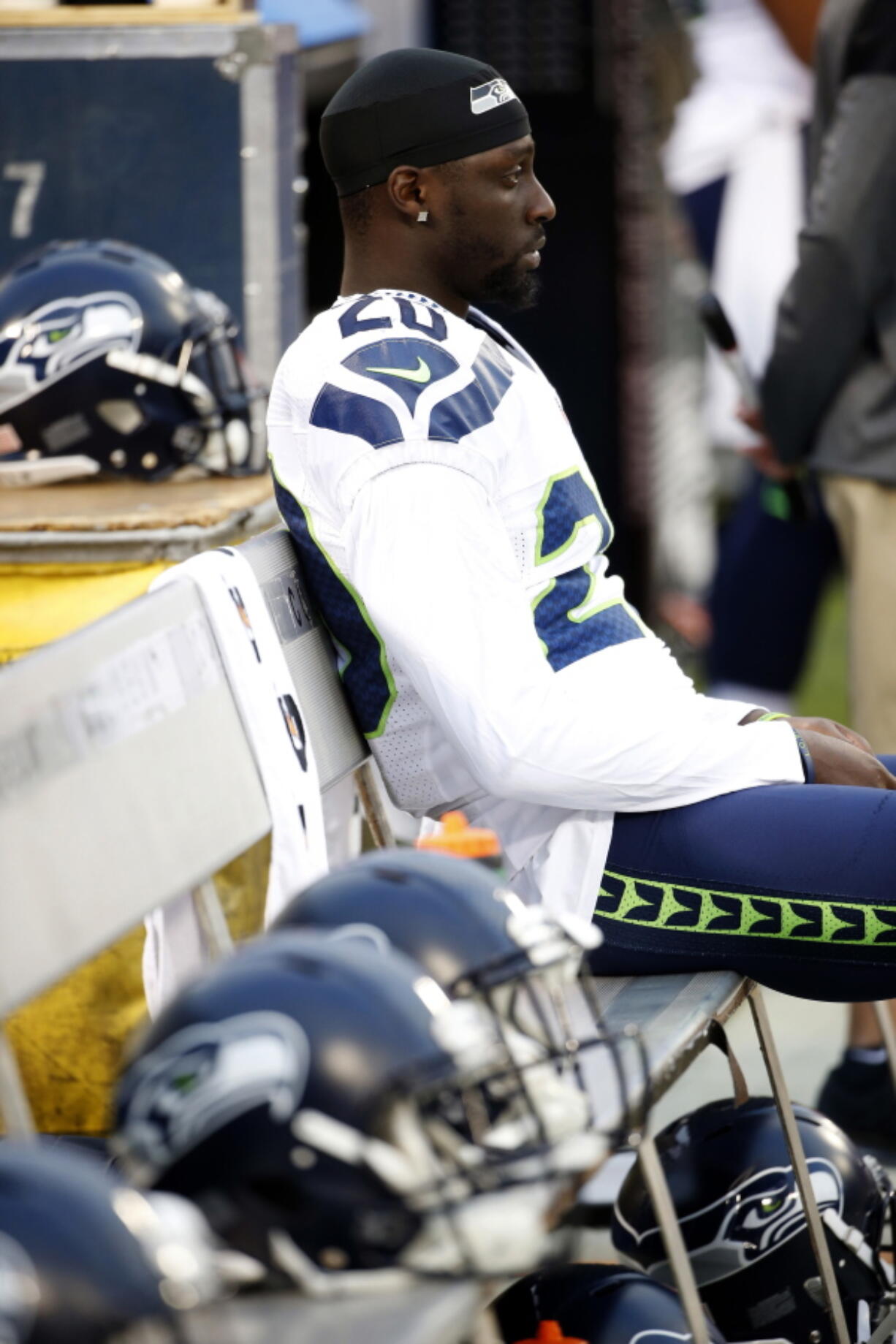 Seahawks cornerback Jeremy Lane sits as the national anthem plays before last week&#039;s game in Oakland.