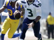 Seattle Seahawks quarterback Russell Wilson (3) has been hobbled by a sore ankle early in the season.