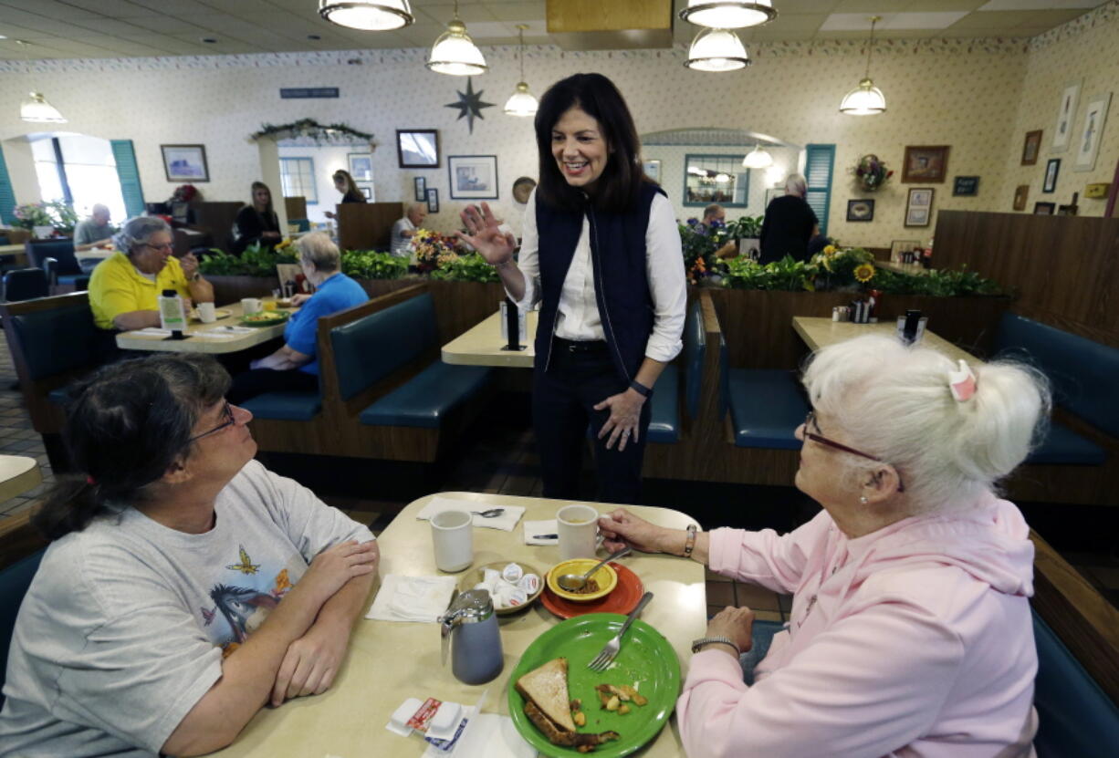 Sen. Kelly Ayotte, R-N.H. speaks to patrons of Blake&#039;s Restaurant as she campaigns for re-election on primary day, Tuesday, in Manchester, N.H.