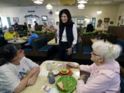 Sen. Kelly Ayotte, R-N.H. speaks to patrons of Blake&#039;s Restaurant as she campaigns for re-election on primary day, Tuesday, in Manchester, N.H.