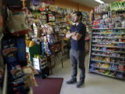 Alex Del Rio stands in the doorway while posing for photos at his family&#039;s market El Ahorro in San Francisco, Wednesday. In November 2016, voters in San Francisco and Oakland will consider a penny per ounce tax on sugar laden drinks such as bottled cola, sports drinks and iced teas in November.