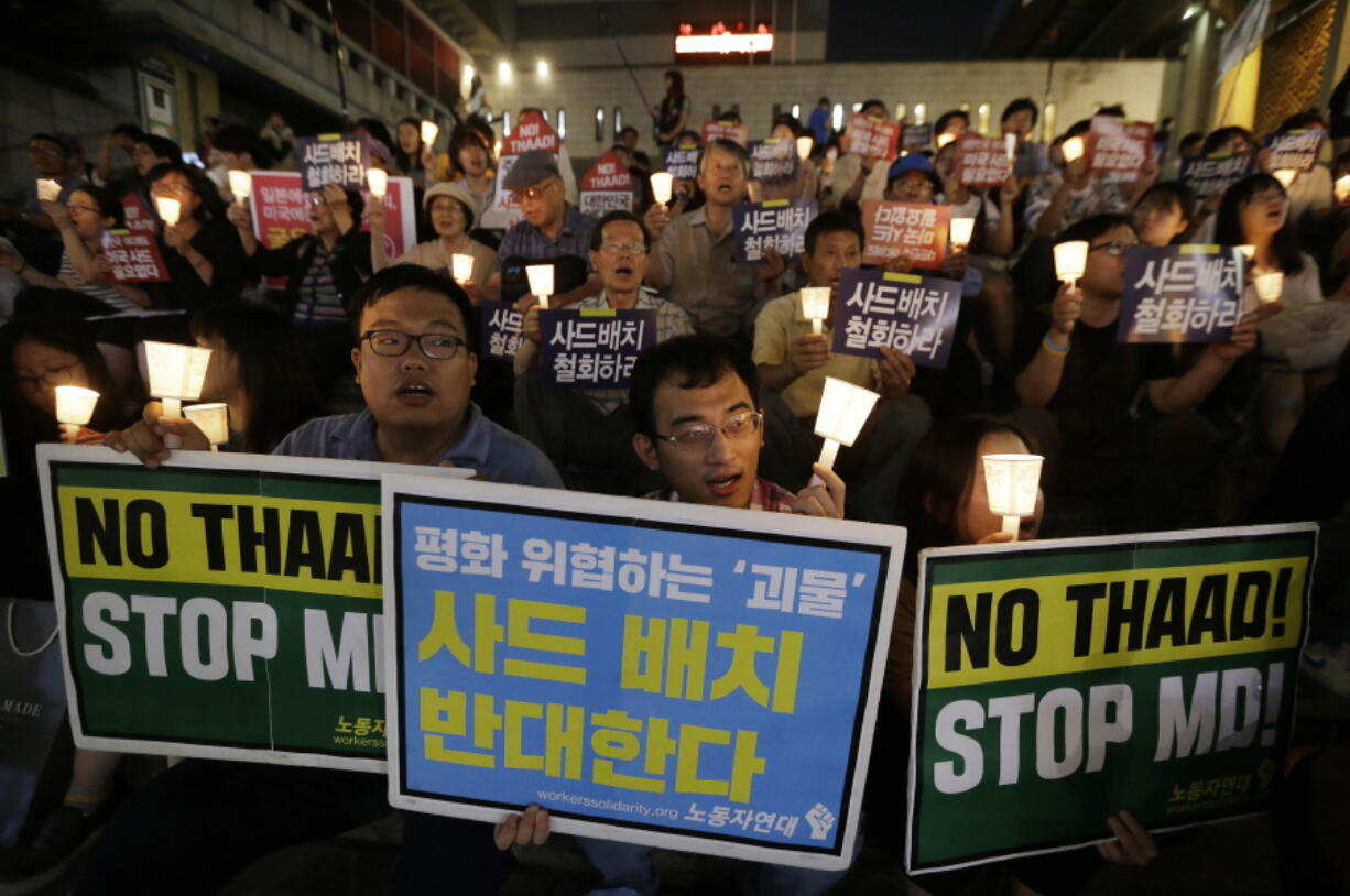 South Korean protesters stage a rally Friday to oppose a deployment of the Terminal High-Altitude Area Defense, or THAAD, in Seoul, South Korea. North Korea said Friday it conducted a &quot;higher level&quot; nuclear warhead test explosion that will allow it to finally build &quot;at will&quot; an array of stronger, smaller and lighter nuclear weapons. It is Pyongyang&#039;s fifth atomic test and the second in eight months.