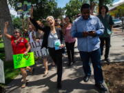 Green Party presidential candidate Jill Stein, center, marches with supporters Saturday through Acacia Park in Colorado Springs, Colo., where she spoke after a rally.