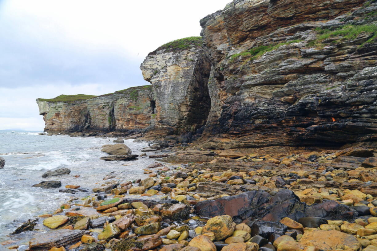 The rocky southern coastline of the Isle of Skye off the west coast of Scotland where Bonny Prince Charlie is said to have found shelter in a cave during his flight from government troops in 1746. Visitors to Skye can take boat trips to this spot or walk along the cliffs.