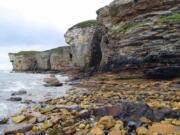 The rocky southern coastline of the Isle of Skye off the west coast of Scotland where Bonny Prince Charlie is said to have found shelter in a cave during his flight from government troops in 1746. Visitors to Skye can take boat trips to this spot or walk along the cliffs.