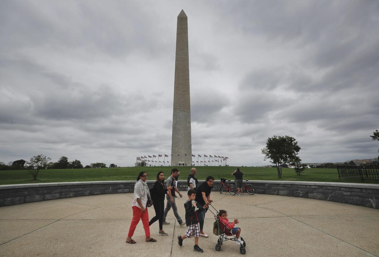 Visitors walks past the Washington Monument on the National Mall in Washington, Monday, Sept. 26, 2016. Elevator trouble closes Washington Monument indefinitely the National Park Service says the Washington Monument will be closed indefinitely because of ongoing problems with its elevator. The park service said in a statement Monday that the monument will remain closed until its elevator control system can be modernized. The lone elevator that takes visitors to the top of the 555-foot obelisk has broken down frequently over the past two years.