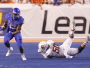 Boise State running back Jeremy McNichols (13) runs the ball past Washington State defensive linesman Hercules Mata'afa (50) during the second half of an NCAA college football game in Boise, Idaho, on Saturday, Sept. 10, 2016.