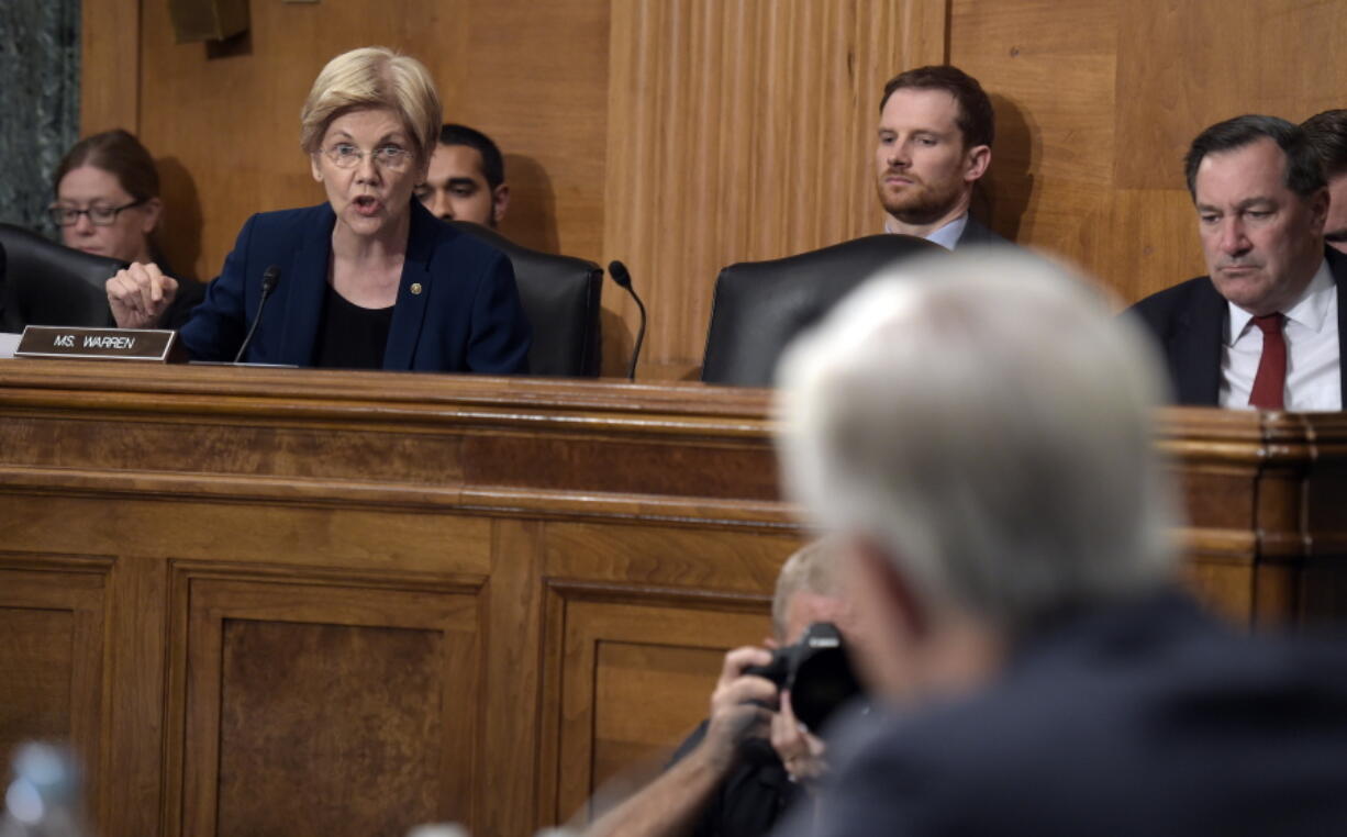 Senate Banking Committee member Sen. Elizabeth Warren, D-Mass., questions Wells Fargo Chief Executive Officer John Stumpf, on Capitol Hill in Washington on Tuesday during the committee&#039;s hearing . Stumpf was called before the committee for betraying customers&#039; trust in a scandal over allegations that employees opened millions of unauthorized accounts to meet aggressive sales targets.