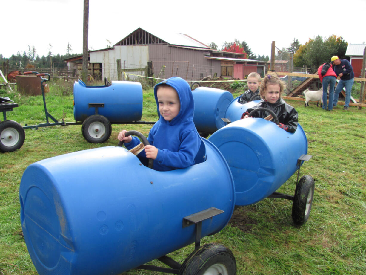 Children enjoy riding the barrel train at Walton Farm.