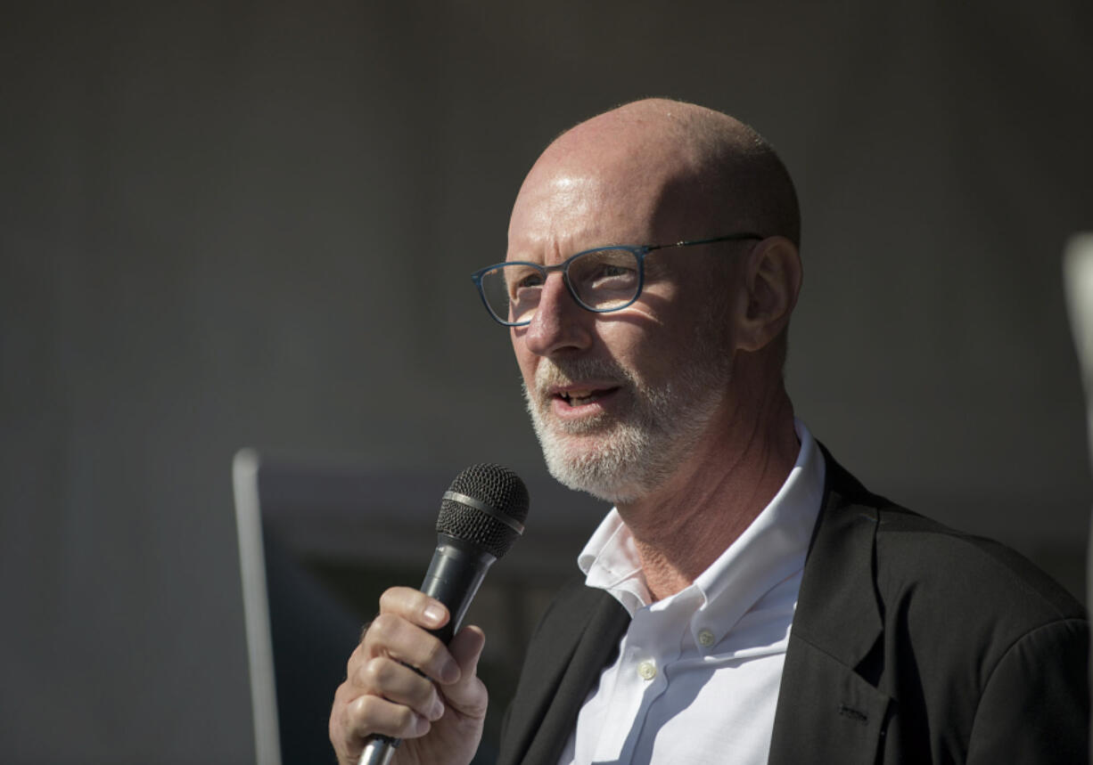 Lighting designer Charles Stone speaks to the crowd Tuesday afternoon as participants gather before a tour of the Vancouver Waterfront.