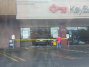 The aftermath following a non-injury crash where someone drove over a curb and through a KeyBank branch's front window Wednesday afternoon in east Vancouver.