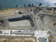 A new public pier at the foot of Grant Street, seen here under early construction in late August, will be a major public attraction at The Waterfront. A hole has been dug for the first building, which can be seen here above Columbia Way.