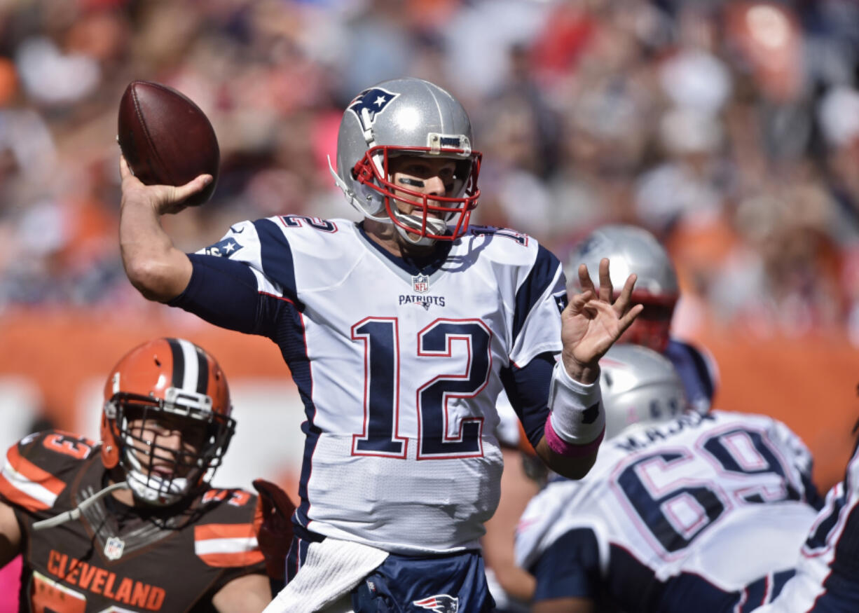 New England Patriots quarterback Tom Brady passes against the Cleveland Browns in the first half of an NFL football game Sunday, Oct. 9, 2016, in Cleveland.