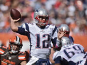 New England Patriots quarterback Tom Brady passes against the Cleveland Browns in the first half of an NFL football game Sunday, Oct. 9, 2016, in Cleveland.