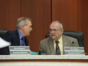 Clark County Councilors David Madore and Tom Mielke take a moment to chat before the start of a March 22 meeting at the Clark County Public Service Center.