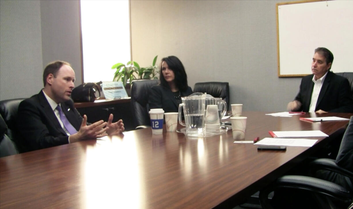 Bill McSherry, vice president of government operations for Boeing Co., left, and Kelly Maloney of Aerospace Futures Alliance of Washington take questions Friday from The Columbian&#039;s Editorial Board, including Editor Lou Brancaccio, right.