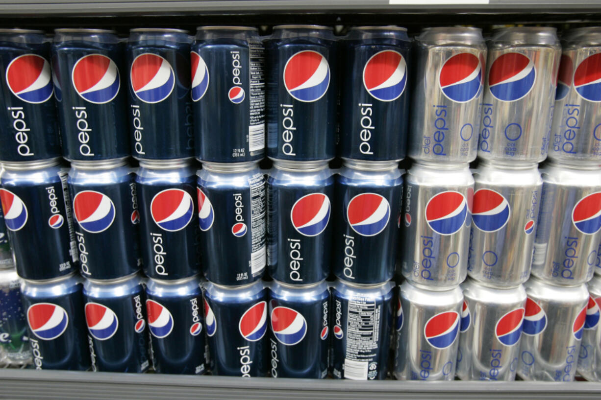 Pepsi drinks are on display at a market in Palo Alto, Calif.