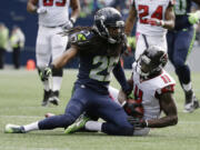 Seattle Seahawks cornerback Richard Sherman (25) gets up after tackling Atlanta Falcons wide receiver Julio Jones (11) in the Seahawks&#039; win over the Falcons.