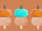 A teal-colored pumpkin represents food allergy awareness among all the orange pumpkins.