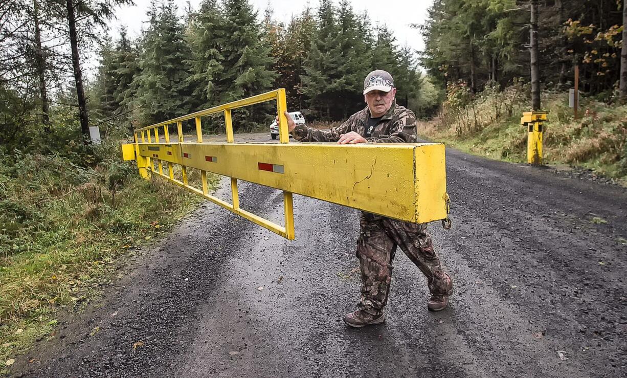 Ray Neuneker can get to his Mount St. Helens hunting areas past the Weyerhaeuser gates because he has paid an access fee.