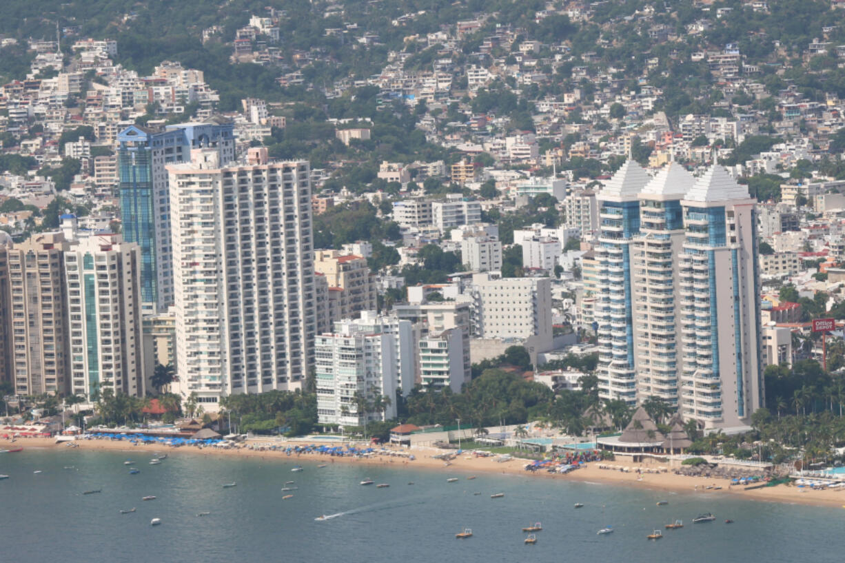 Gleaming beachside hotels and residences on Acapulco Bay -- seen from a distance -- suggest a sense of jet-set glamour. At night, the view is spectacular as ever.