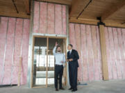 Sean McClain, founder and CEO of AbSci, left, guides Gov. Jay Inslee through the biotechnology company&#039;s new Vancouver headquarters on Monday. AbSci is moving its headquarters from Portland to the new Hudson Building in downtown Vancouver.