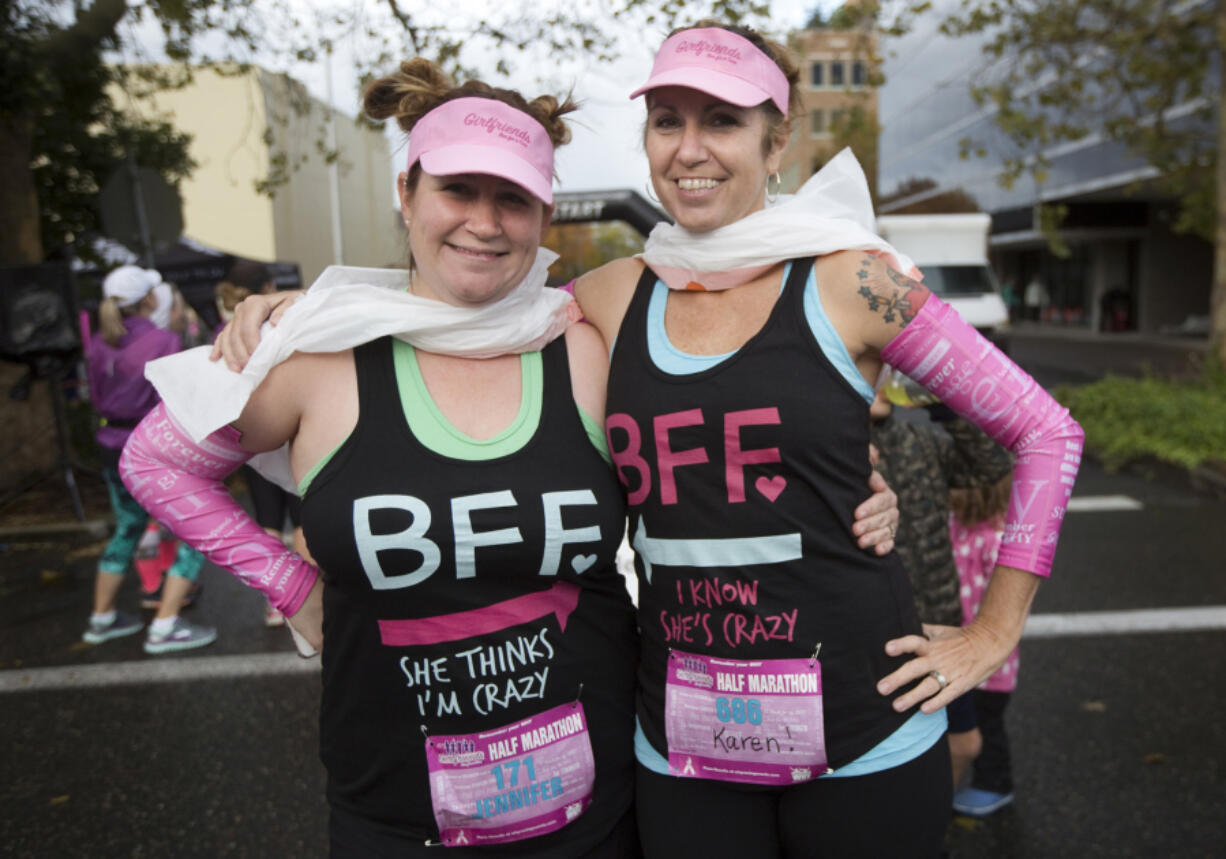 Best friends Jennifer Gorder and Karen Johnson take part in the annual Girlfriends Run for a Cure in Vancouver on Sunday. Johnson is a breast cancer survivor.