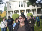 Historian Jeff Davis leads guests away from the O.O. Howard House on Sunday during a Spirit Tales walking tour around Officers Row and the West Barracks. The tour was presented by the Fort Vancouver National Trust.