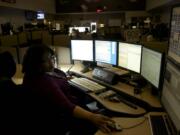 CRESA dispatcher Cassandra Deering operates her computer on a night shift on Friday, May 2, 2014.