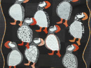 A quilt stuffed with puffins by Val Pelens.