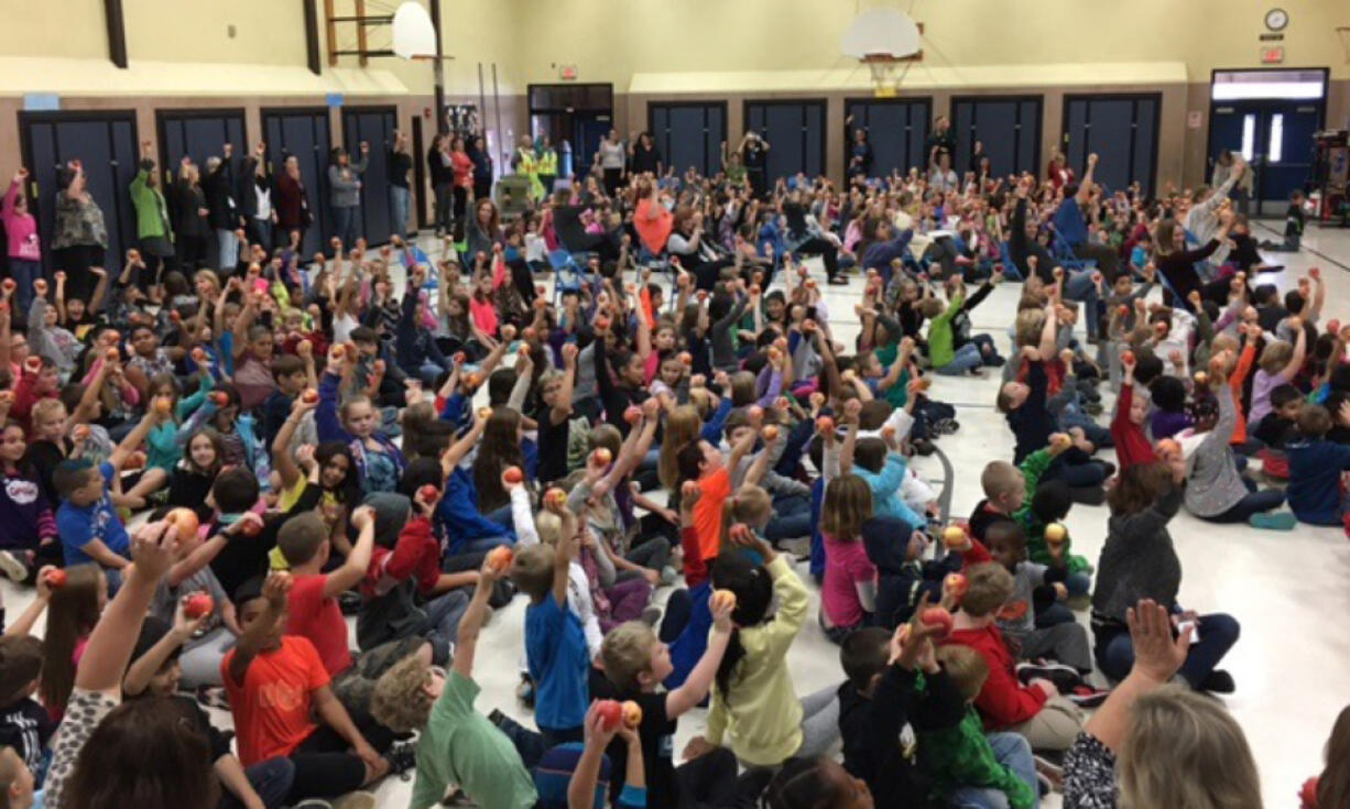 Five Corners: Students at Silver Star Elementary School participate in an &quot;apple crunch&quot; in honor of Taste Washington Day.