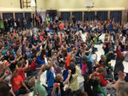 Five Corners: Students at Silver Star Elementary School participate in an &quot;apple crunch&quot; in honor of Taste Washington Day.