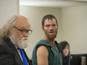 Shaun Michael Sprague, center, who is accused of opening fire inside the Hazel Dell Wal-Mart on Wednesday morning, makes a first appearance Thursday in Clark County Superior Court (Amanda Cowan/The Columbian)