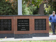 Gary Matthiessen walks past a new memorial bearing the names of 58 Clark County men who were killed in Vietnam; it was dedicated Saturday.