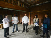 Clark College Cuisine Instructor Aaron Guerra, center, talks Thursday to interested wine and beer distributors about Clark College&#039;s new culinary program during a tour of the facility that&#039;s under construction, aiming to open next fall.