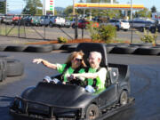 Salmon Creek: In honor of Active Aging Week, members of Highgate Senior Living, including executive director Melanie Danelson, left, and resident Lyle Brown, took a trip go-karting.