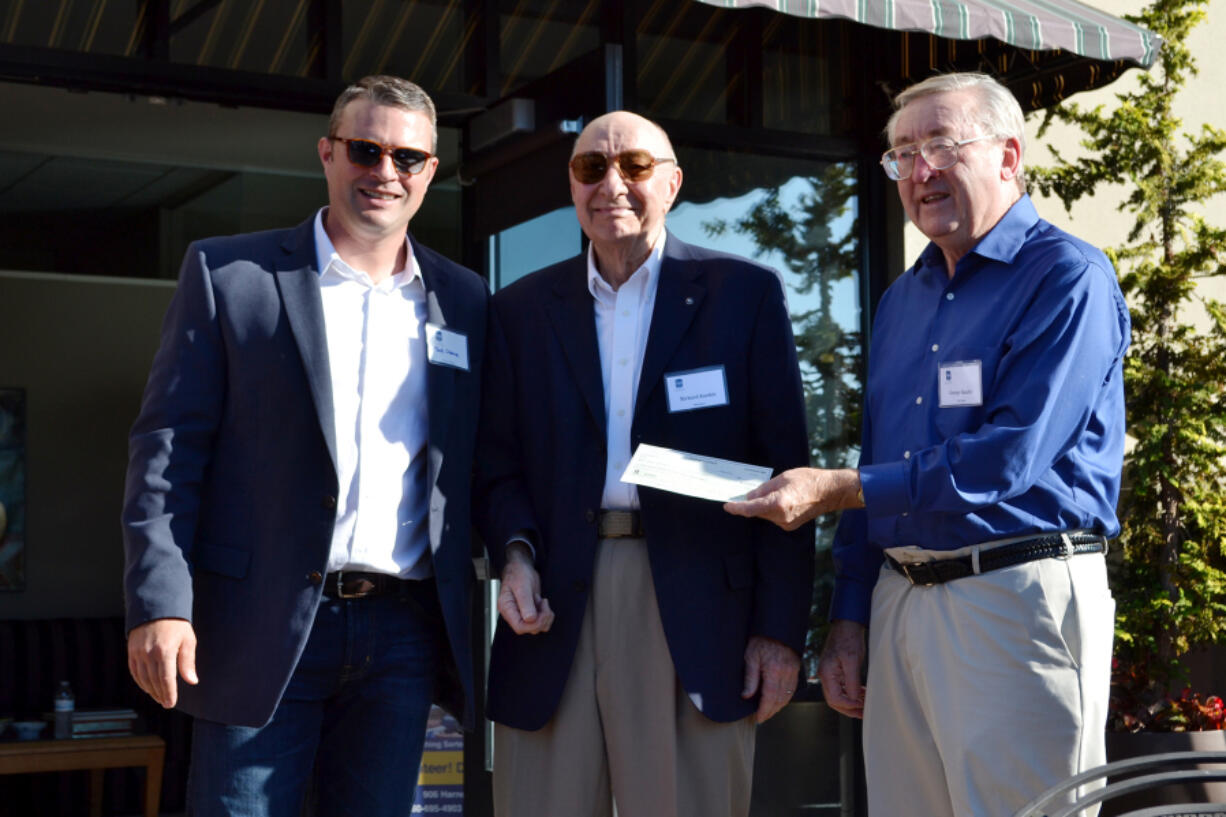 Esther Short: Friends in Service to Humanity pantry officials handed in their last mortgage payment on Sept. 13 to finish out their &quot;Debt Free in 2016&quot; campaign. From left: Mark Osborne, managing partner of C.E.