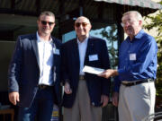 Esther Short: Friends in Service to Humanity pantry officials handed in their last mortgage payment on Sept. 13 to finish out their &quot;Debt Free in 2016&quot; campaign. From left: Mark Osborne, managing partner of C.E.