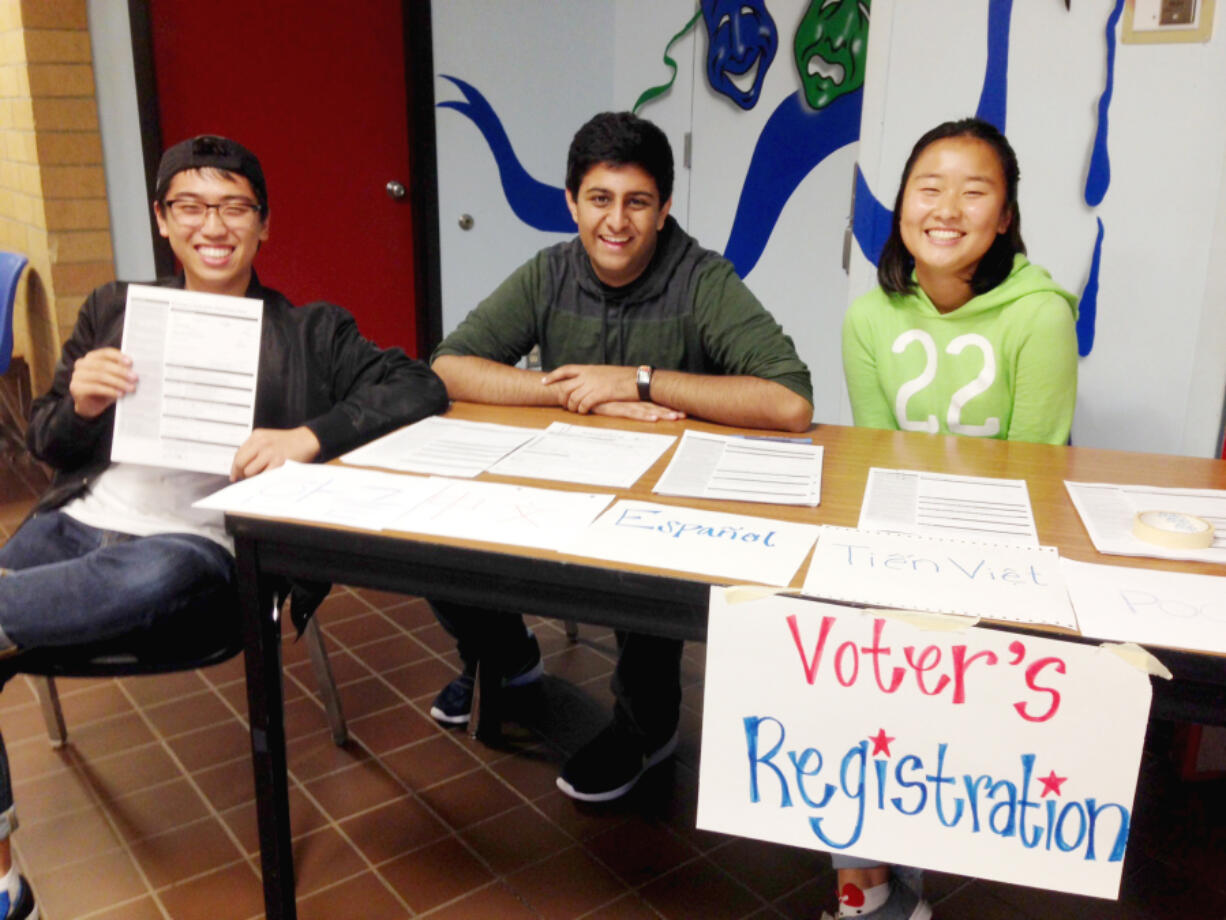 Mountain View: Mountain View High School senior Jonathan Baek, from left, was one of 20-plus students who registered to vote at the school through an effort by Zane Chowdhry, Grace Yang, and the school&#039;s National Honor Society members and Contemporary World Issues instructors.