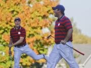 United States’ Patrick Reed celebrates his birdie on the 14th hole with United States’ Jordan Spieth during a four-ball match at the Ryder Cup golf tournament Saturday, Oct. 1, 2016, at Hazeltine National Golf Club in Chaska, Minn.