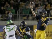 California quarterback Davis Webb (7) passes against Oregon during the first half of an NCAA college football game in Berkeley, Calif., Friday, Oct. 21, 2016.