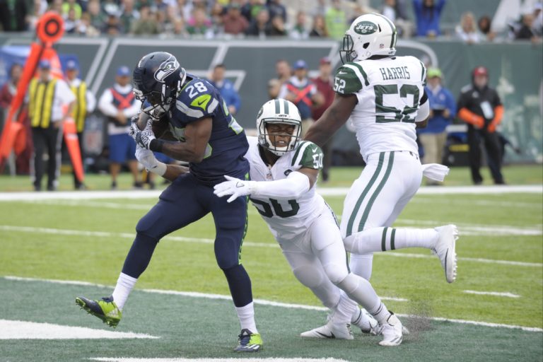 Seattle Seahawks C.J. Spiller catches a pass for a touchdown in front of New York Jets' Darron Lee (50) during the first half of an NFL football game Sunday, Oct. 2, 2016, in East Rutherford, N.J.