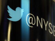 The Twitter logo appears on a phone post on the floor of the New York Stock Exchange, Thursday, Oct. 27, 2016. Twitter announced it is cutting about 9 percent of its employees worldwide. The company&#039;s third quarter performance topped Wall Street&#039;s expectations.