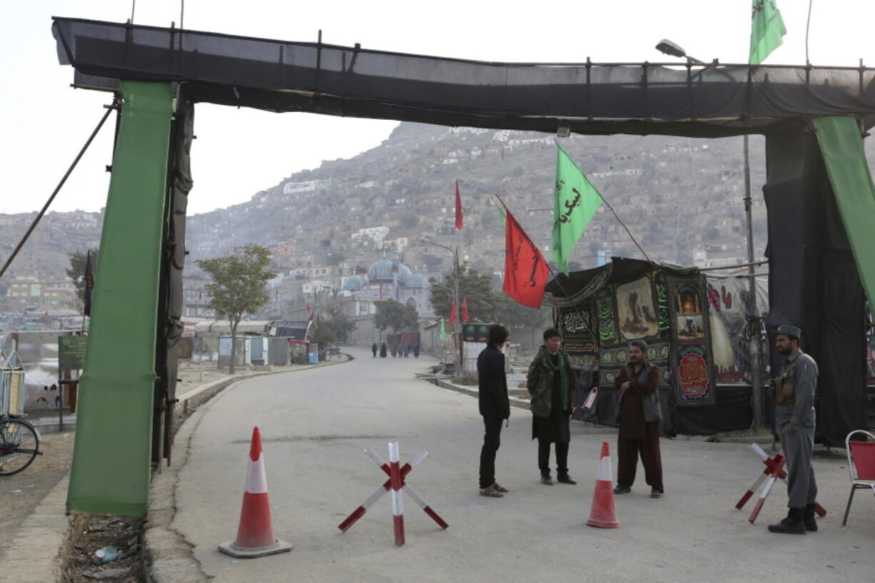 Afghan security policemen stand guard in front of Kart-e-Sakhi shrine in Kabul, Afghanistan Wednesday, Oct. 12, 2016, following Tuesday night&#039;s militant attack. Militants attacked the Shiite shrine on Tuesday, killing more than two dozen people and deepening fears of a spasm of violence against Afghanistan&#039;s Shiites as they mark one of their most important religious days later this week.