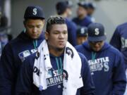 Seattle Mariners starting pitcher Felix Hernandez walks in the dugout during the fifth inning of a baseball game against the Oakland Athletics, Sunday, Oct. 2, 2016, in Seattle. (AP Photo/Ted S.