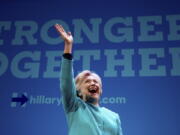 Democratic presidential candidate Hillary Clinton waves as she takes the stage to speak at a fundraiser Friday at the Paramount Theatre in Seattle.