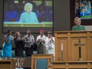 Democratic presidential candidate Hillary Clinton is joined by mothers of black men who died from gun violence, as she speaks during Sunday service at Union Baptist church in Durham, N.C.