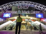 A member of the security team stands in front of the presidential debate site at the University of Nevada, Las Vegas in Las Vegas late Sunday. Democratic presidential nominee Hillary Clinton and Republican presidential nominee Donald Trump will meet in their third and final debate on Wednesday. (AP Photo/J.