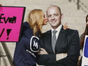 Brynnley Pyne pretends to kiss a cardboard cutout of Evan McMullin as McMullin supporters rally at the Utah State Capitol in Salt Lake City.  (Jeffrey D.